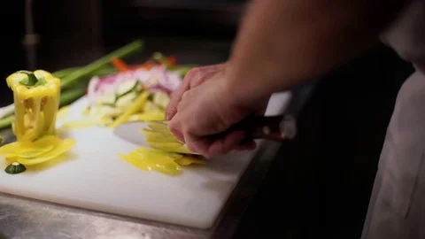 Chef Preparing Peppers on Chopping Board Stock Footage 72922590