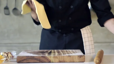 Chef preparing a pizza base Stock Footage 66587418
