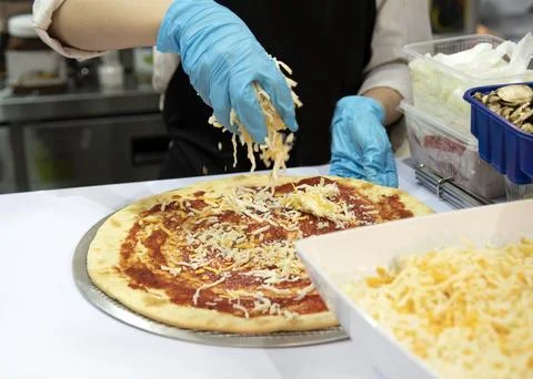 Chef preparing pizza, Chef process of making pizza in pizza restaurant Stock Photos