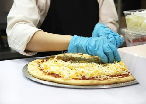 Chef preparing pizza, Chef process of making pizza in pizza restaurant Stock Photos