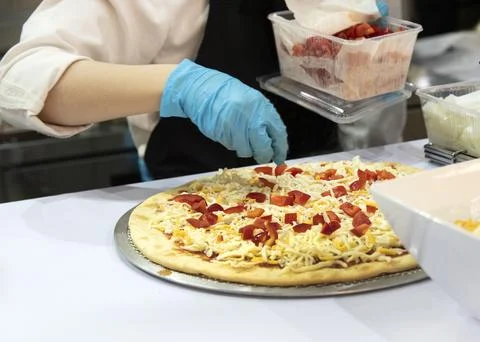 Chef preparing pizza, Chef process of making pizza in pizza restaurant Stock Photos