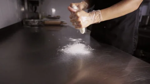 Chef preparing a pizza. Chef tossing pizza dough in commercial kitchen. Stock Footage 68851368