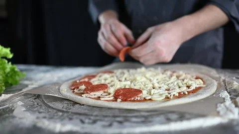 The chef is preparing pizza. close-up video of the cooking process Stock Footage 235884945