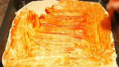 Chef preparing pizza. Making pizza. Cooking process. Cooking pizza. Ketchup Stock Footage 98125018