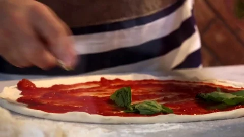 Chef preparing a pizza margherita Stock Footage 71583334