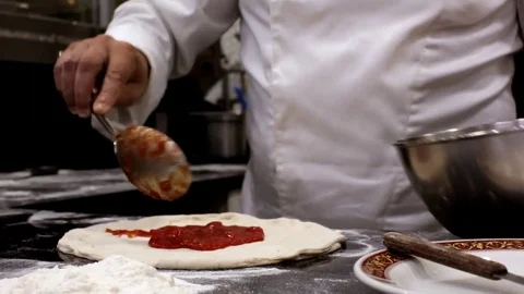 Chef preparing a pizza margherita Stock Footage 71584427