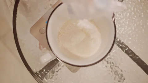 Chef preparing pumpkin pie with accurate sugar measurement. Scene of baker Stock-Footage 346393361