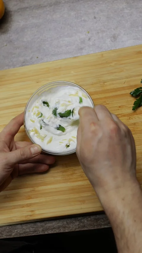 Chef is preparing ranch sauce for the vegetables in the restaurant's kitchen. Stock Footage 273532832