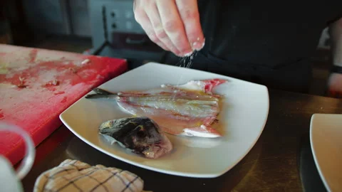 Chef Preparing Raw Fish With Oil And Salt Stock Footage 284236723