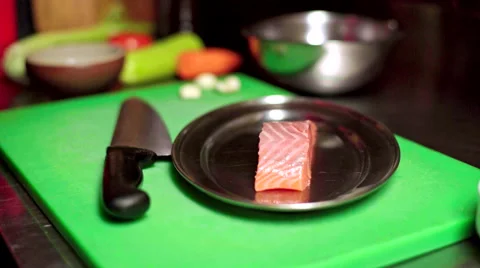Chef preparing salmon for baking Stock Footage 60018358