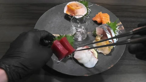 Chef preparing Sashimi in the kitchen Stock Footage 138418168