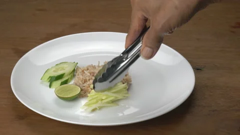 Chef preparing shrimp paste fried rice in white ceramic dish. Stock Footage 198007317