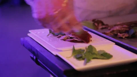 Chef Preparing Sliced Roast Meat with Fresh Herbs in Beijing Restaurant Kitchen Stock Footage 345744225