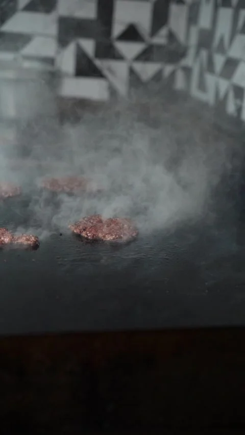 The chef is preparing smash burgers. Stock Footage 294956055