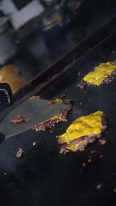 The chef is preparing smash burgers. Stock Footage 294956059