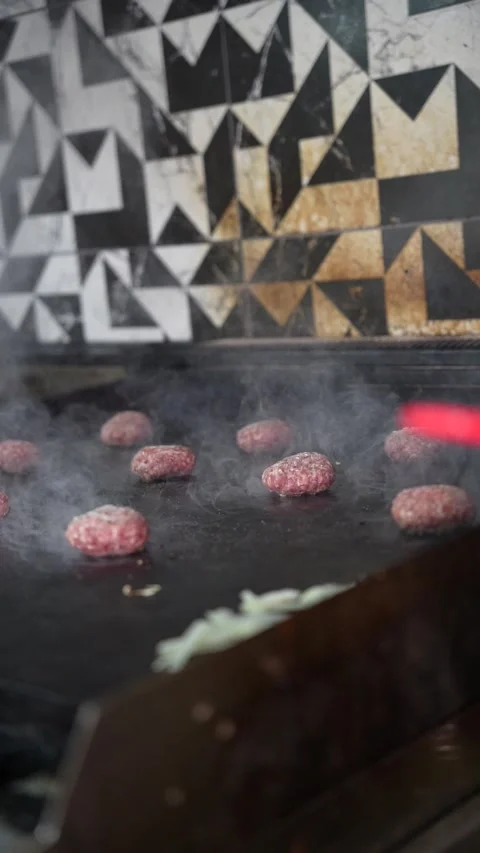 The chef is preparing smash burgers. Stock Footage 294956072