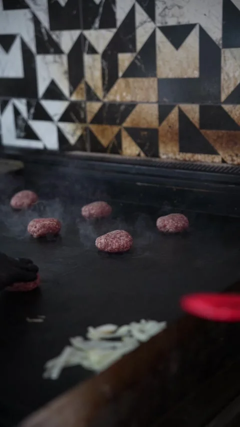 The chef is preparing smash burgers. Stock Footage 294956084