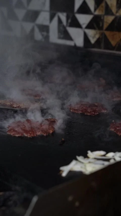 The chef is preparing smash burgers. Stock Footage 294956085