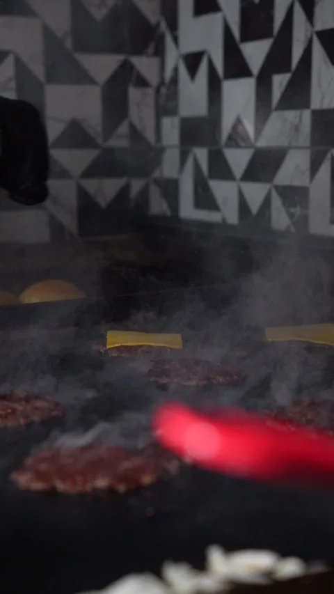 The chef is preparing smash burgers. Stock Footage 294956099