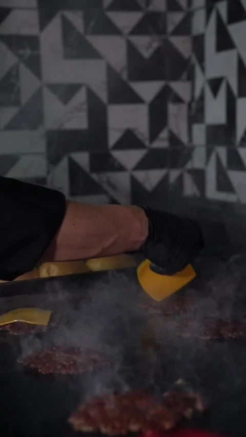 The chef is preparing smash burgers. Stock Footage 294956126