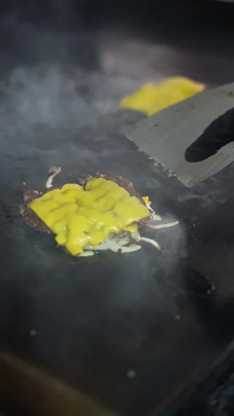 The chef is preparing smash hamburgers Stock Footage 294955827