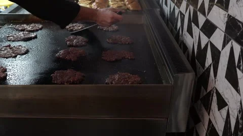 The chef is preparing smash hamburgers Stock Footage 294955832