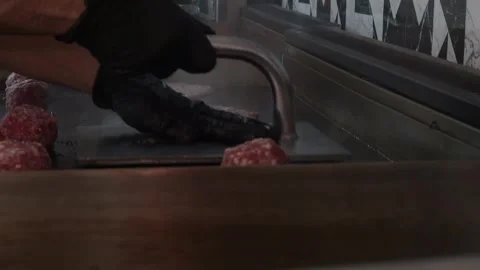 The chef is preparing smash hamburgers Stock Footage 294955837