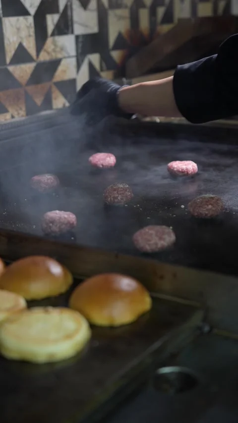 The chef is preparing smash hamburgers Stock Footage 294955841