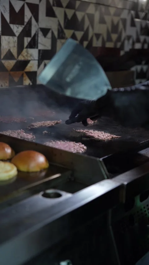 The chef is preparing smash hamburgers Stock Footage 294955887