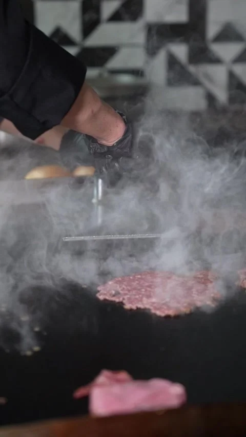 The chef is preparing smash hamburgers Stock Footage 294955916