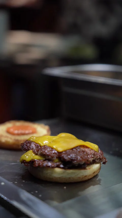 The chef is preparing smash hamburgers Stock Footage 294955938