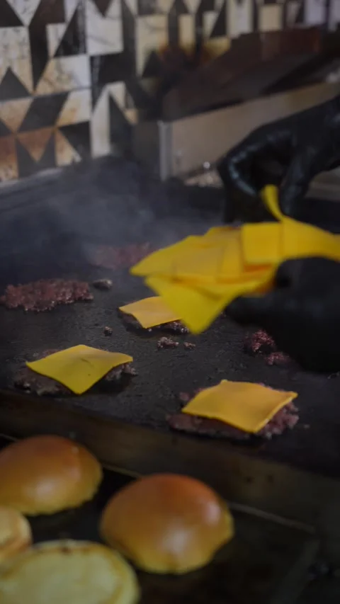 The chef is preparing smash hamburgers Stock Footage 294955986