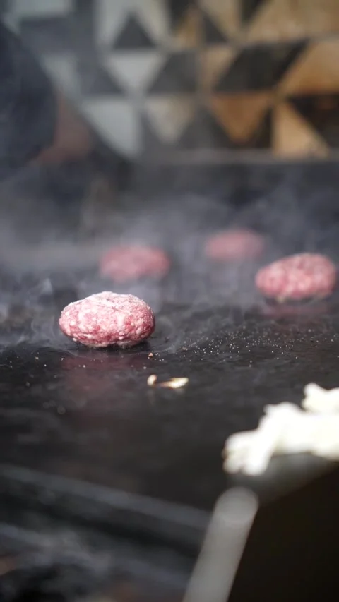The chef is preparing smash hamburgers Stock Footage 294955997