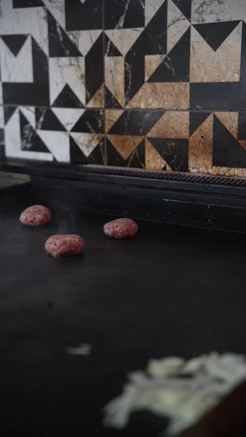 The chef is preparing smash hamburgers Stock Footage 294956007