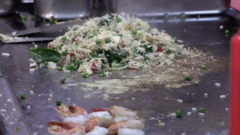 Chef preparing spicy vegetable rice and prawns at Chinese restaurant Stock Footage 85964249