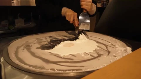 Chef Preparing Stir-Fried Rolled Ice Cream on Cold Plate Pan Stock Footage 345293018