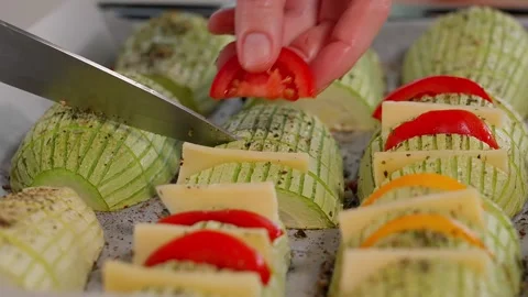 The chef is preparing stuff zucchini with pieces of cheese and tomato Stock Footage 270150326