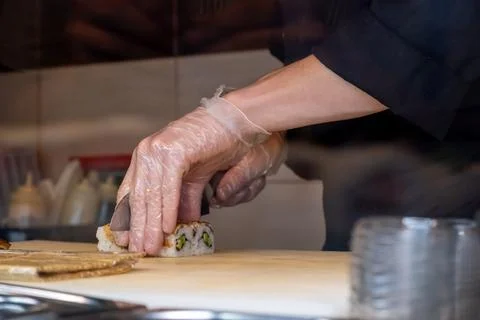 Chef preparing sushi in a restaurant Stock Photos