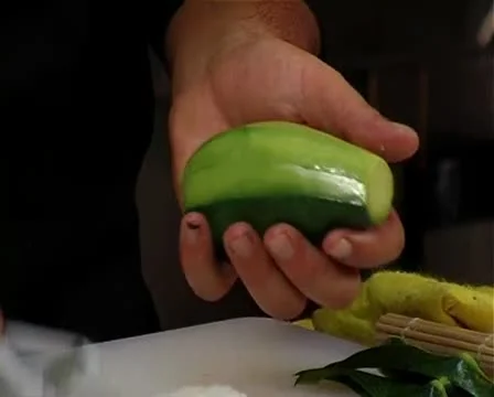 Chef Preparing Sushi Roll Covered in avvocado Stock-Footage 10610287