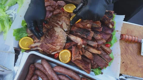 Chef Preparing a Taiwanese Barbecue Meat Platter with Roasted Pork, Sausage.. Stock Footage 341155052