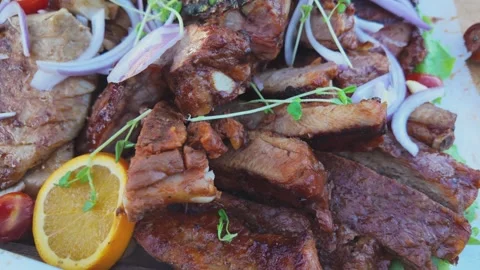 Chef Preparing a Taiwanese Barbecue Meat Platter with Roasted Pork, Sausage.. Stock Footage 341155081