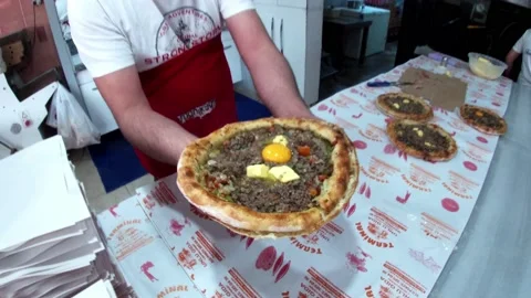 Chef preparing Trabzon Pide Stock Footage 164810783