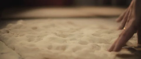 Chef preparing traditional pizza al taglio dough with his hands, slowly knead Stock Footage 146601118