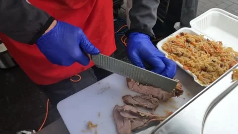 Chef Preparing Traditional Silk Road Street Food at Walthamstow Market Stock Footage 318995045