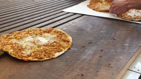 Chef Preparing Traditional Turkish Lahmacun on Wooden Counter Stock Footage 342781575