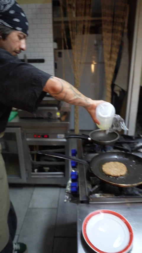 Chef preparing vegan burger in restaurant - July 3 2026 Fethiye Mugla Turkey Stock Footage 340396929