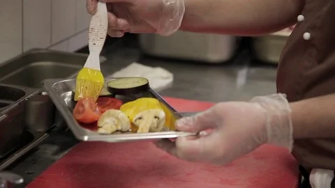 Chef preparing vegetables to fry on grill in modern restaurant kitchen Stock Footage 76626956