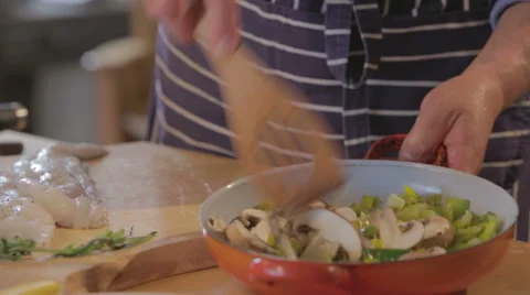 Chef preparing vegetables on frying pan Stock Footage 58092888