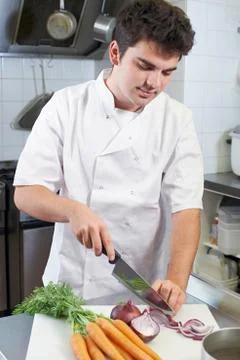 Chef Preparing Vegetables In Restaurant Kitchen Stock Photos