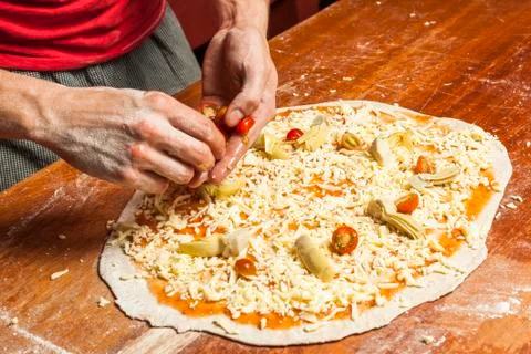 Chef preparing vegetarian pizza Stock Photos
